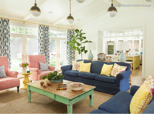 Blue loveseat on right with Blue sofa an d two pink arm chairs