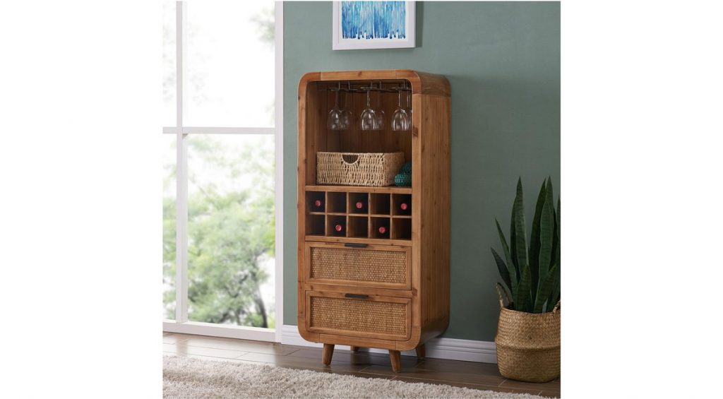 wooden bar cabinet with glasses in it and a plant beside it