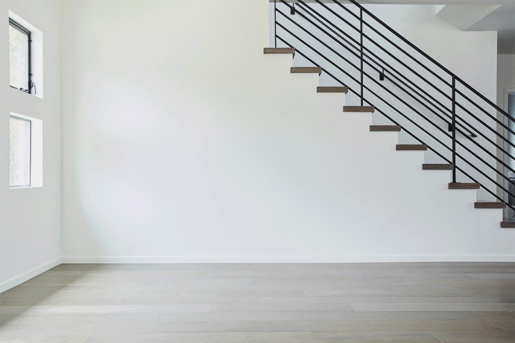 empty white room with a staircase