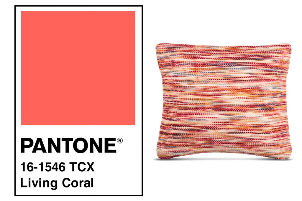 living coral pantone color with a multicolored pillow