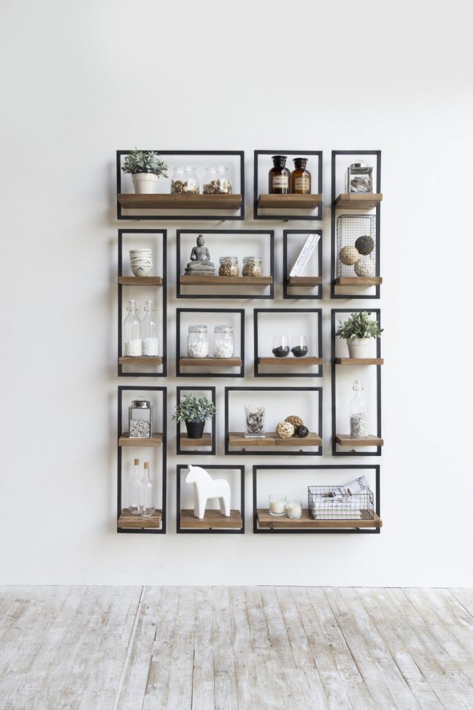 wall shelves with art pieces in it
