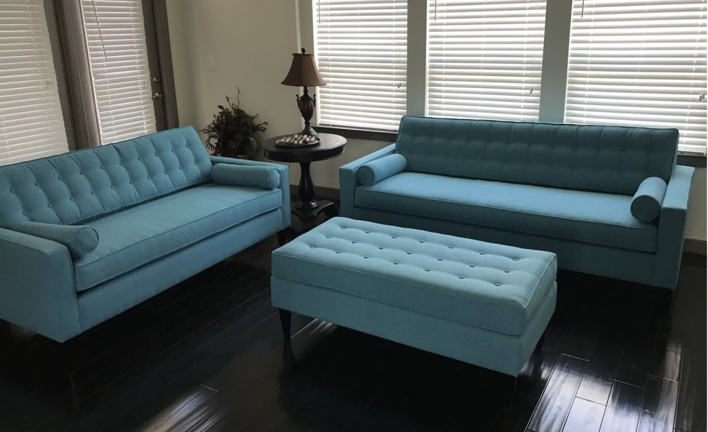 two blue sofas and a blue ottoman