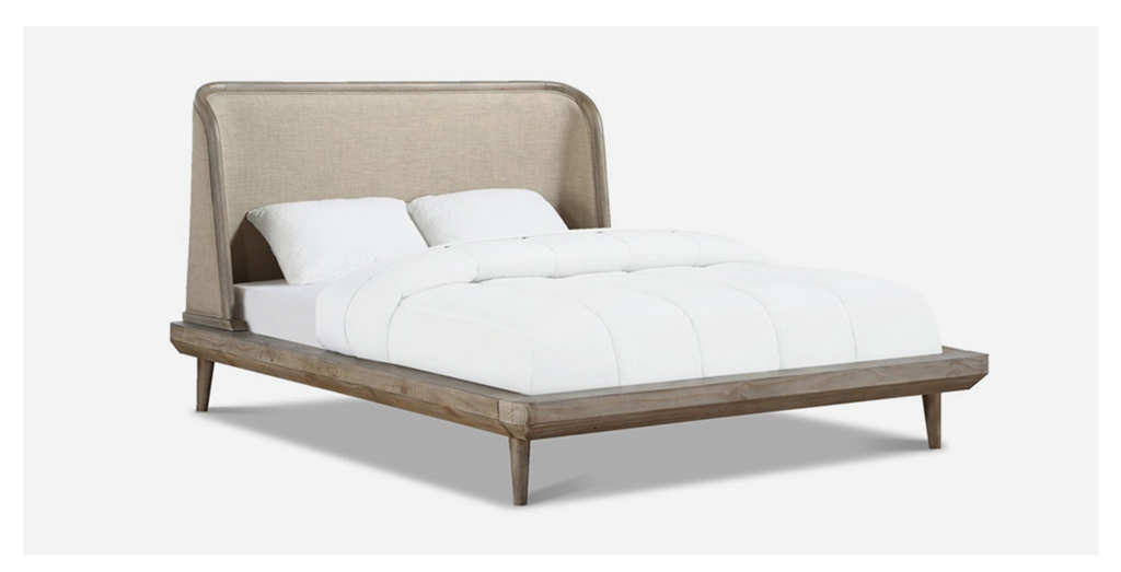 beige bed with white cover and pillows