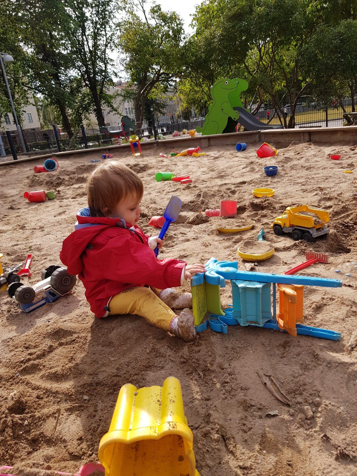 small child playing in sand