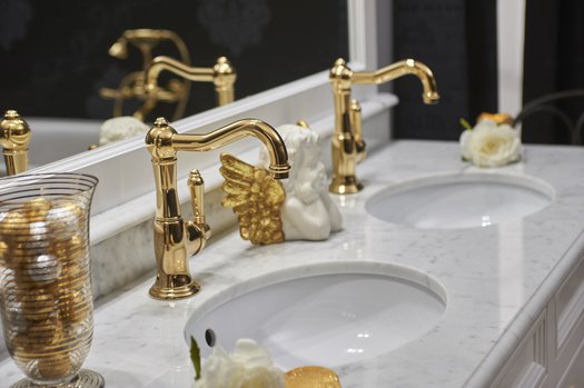 Gold brass cottage tap on a classic bathroom vanity unit