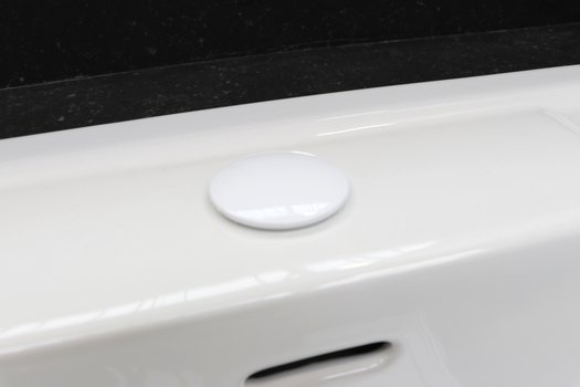 Plate to hide tap hole