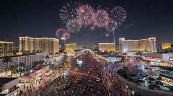 Las Vegas Strip fireworks and pedestrian crowds during a New Year's Eve celebration