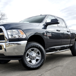 Black 2014 Ram 2500 with ARIES 3-inch side bars