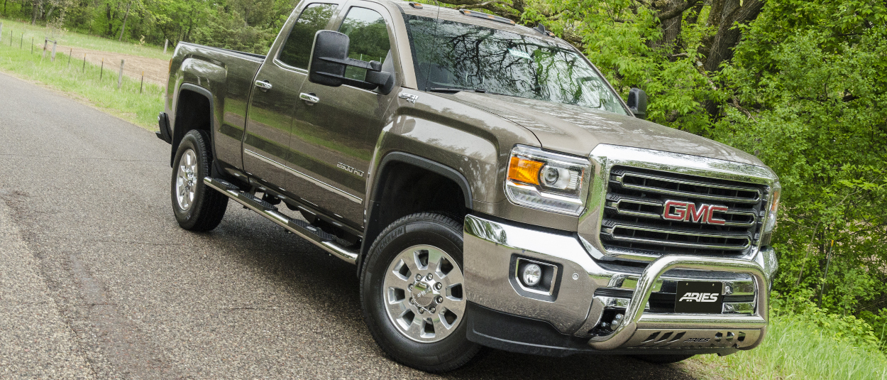 2015 GMC Sierra 2500 HD with ARIES 4-inch oval side bars and accessories