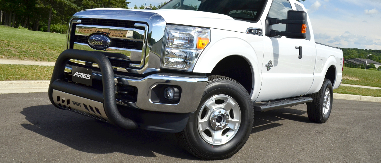 2016 Ford F350 Super Duty with ARIES 6-inch oval side bars and truck accessories