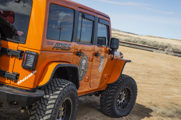 ARIES custom Jeep fender flares on orange 2013 Jeep Wrangler JK Unlimited