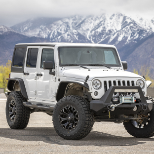 White 2016 Jeep Wrangler JK Unlimited with ARIES Jeep fender flares and Jeep accessories