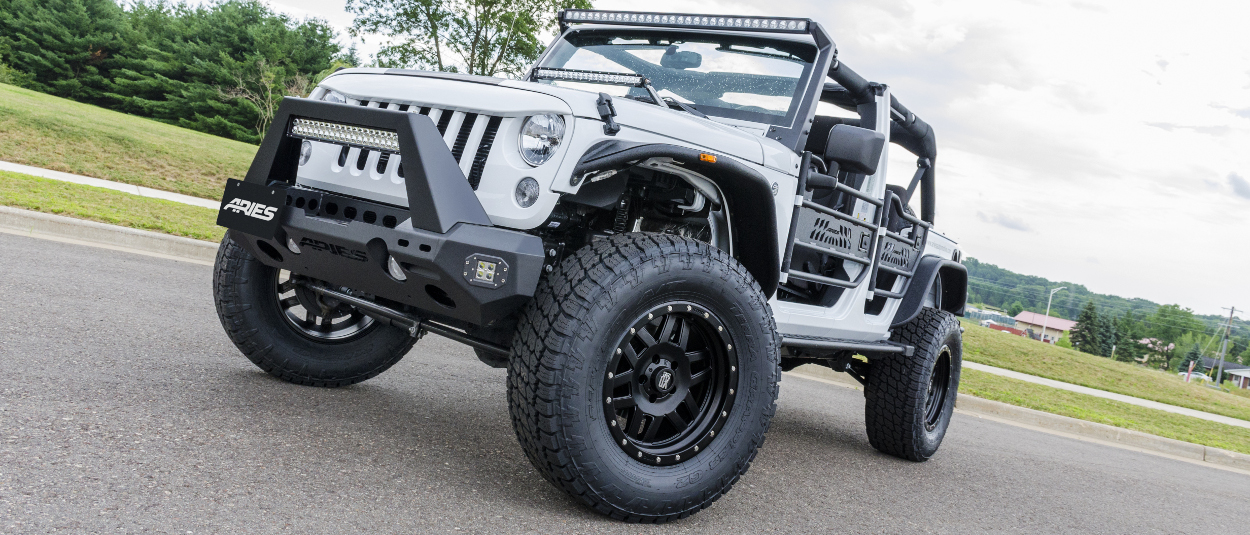 White Jeep Wrangler with ARIES Jeep doors, bumper, lights and fender flares White Jeep Wrangler with ARIES Jeep doors, bumper, lights and fender flares