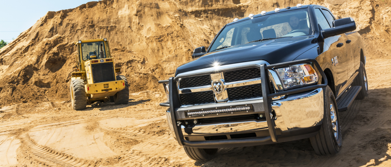 2015 Ram 3500 work truck with ARIES RidgeStep® running boards and truck accessories - construction site