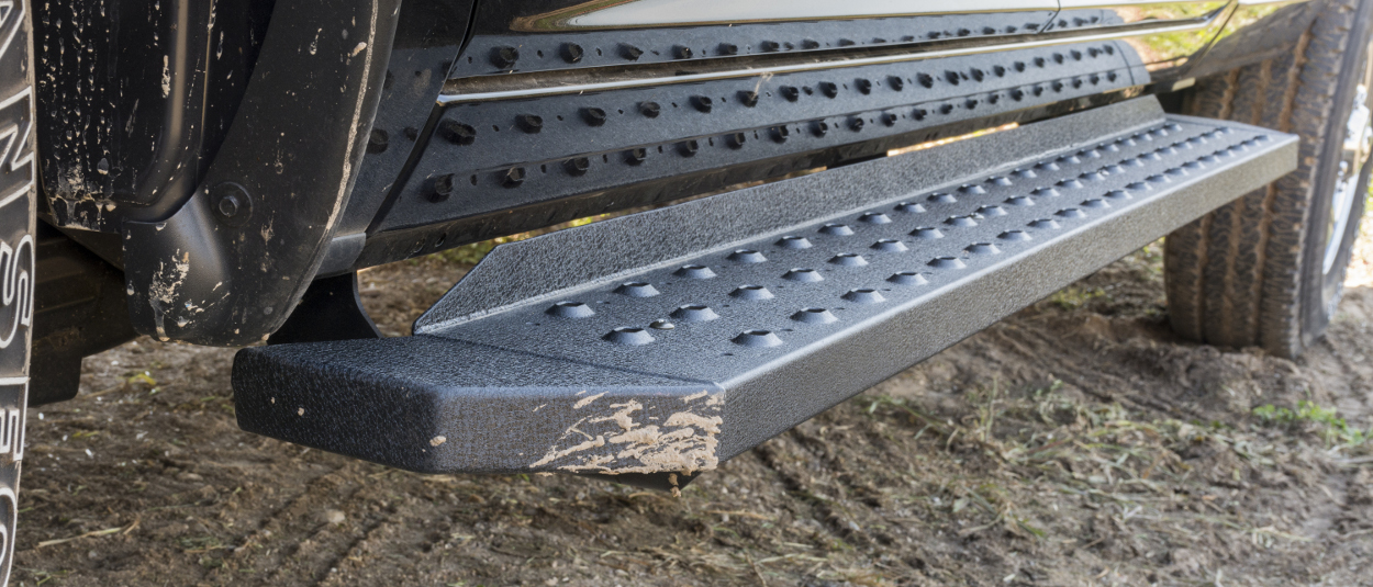 ARIES RidgeStep® running boards on work truck - mud