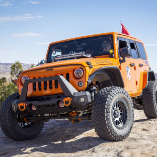 Custom orange 2013 Jeep Wrangler JK with ARIES TrailChaser® bumper