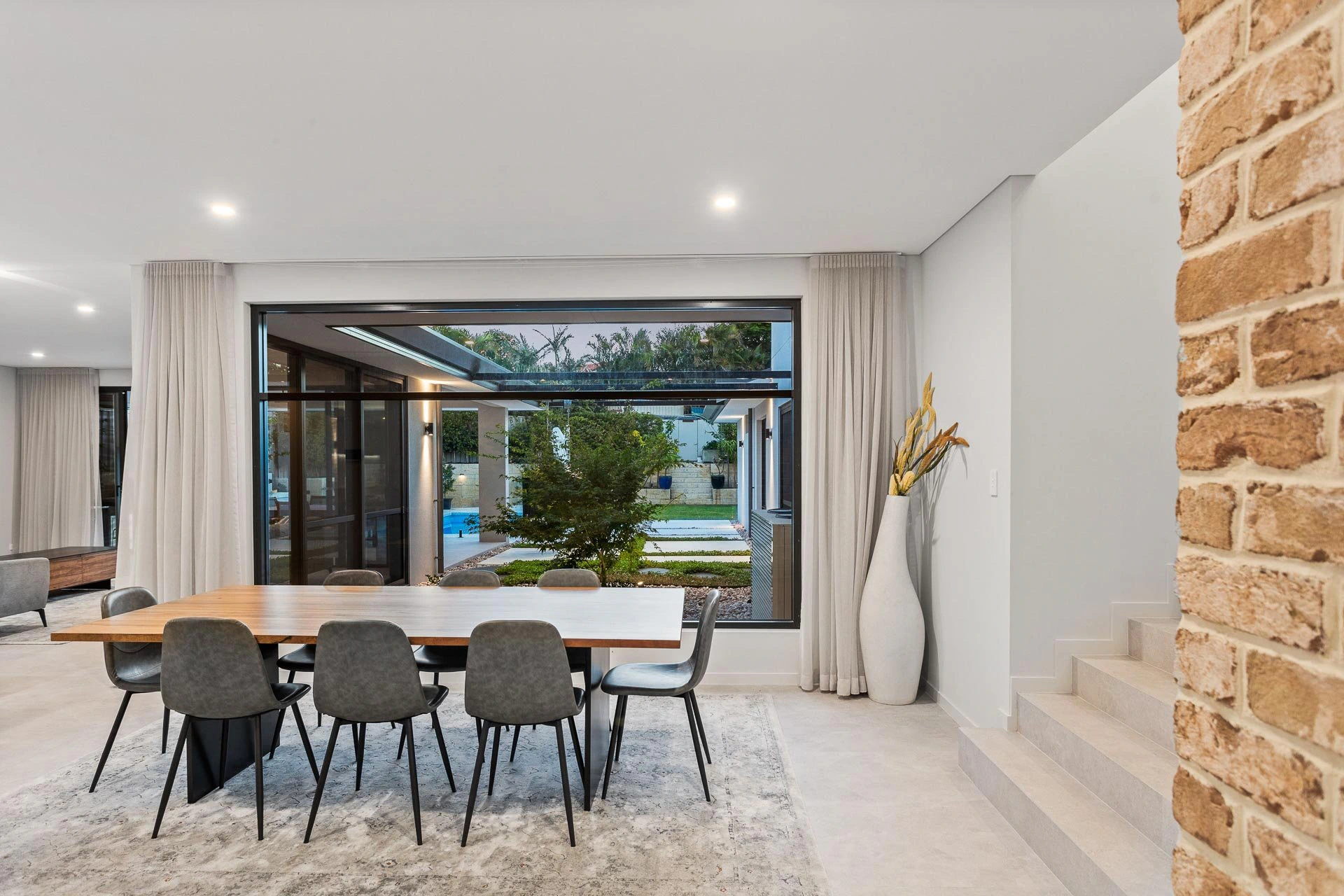 Open-plan dining area overlooking outdoor garden