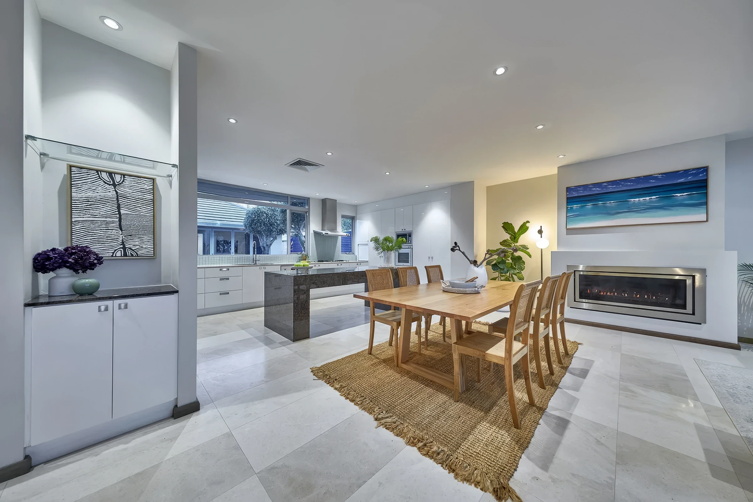 Open-plan kitchen and dining area with modern design and natural light