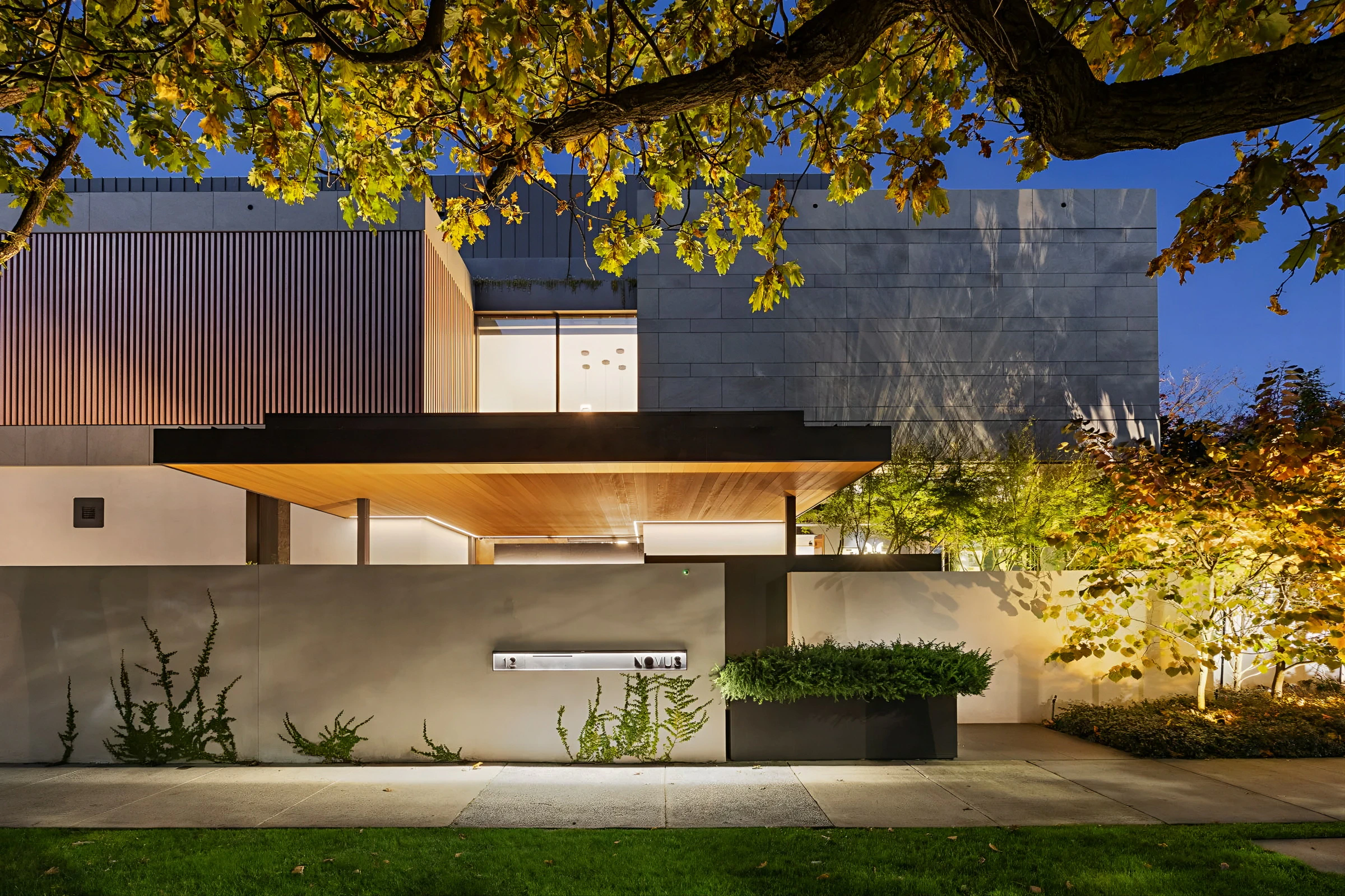 Modern luxury house exterior with illuminated façade