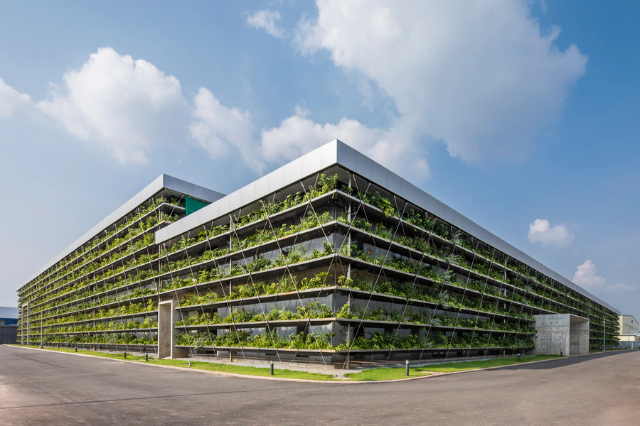 Jakob Factory planted façade and stainless-steel cable lattice