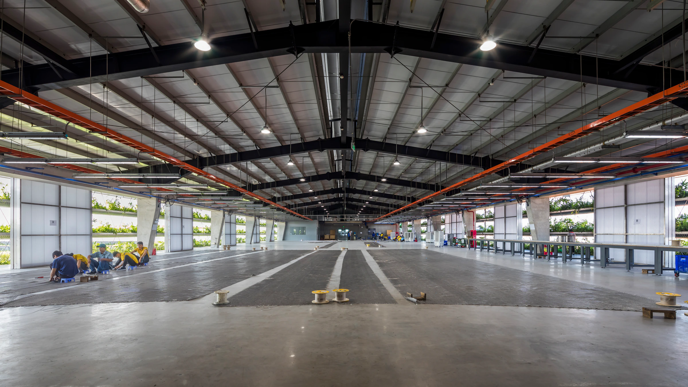 Jakob Factory production hall, concrete floor and exposed roof services