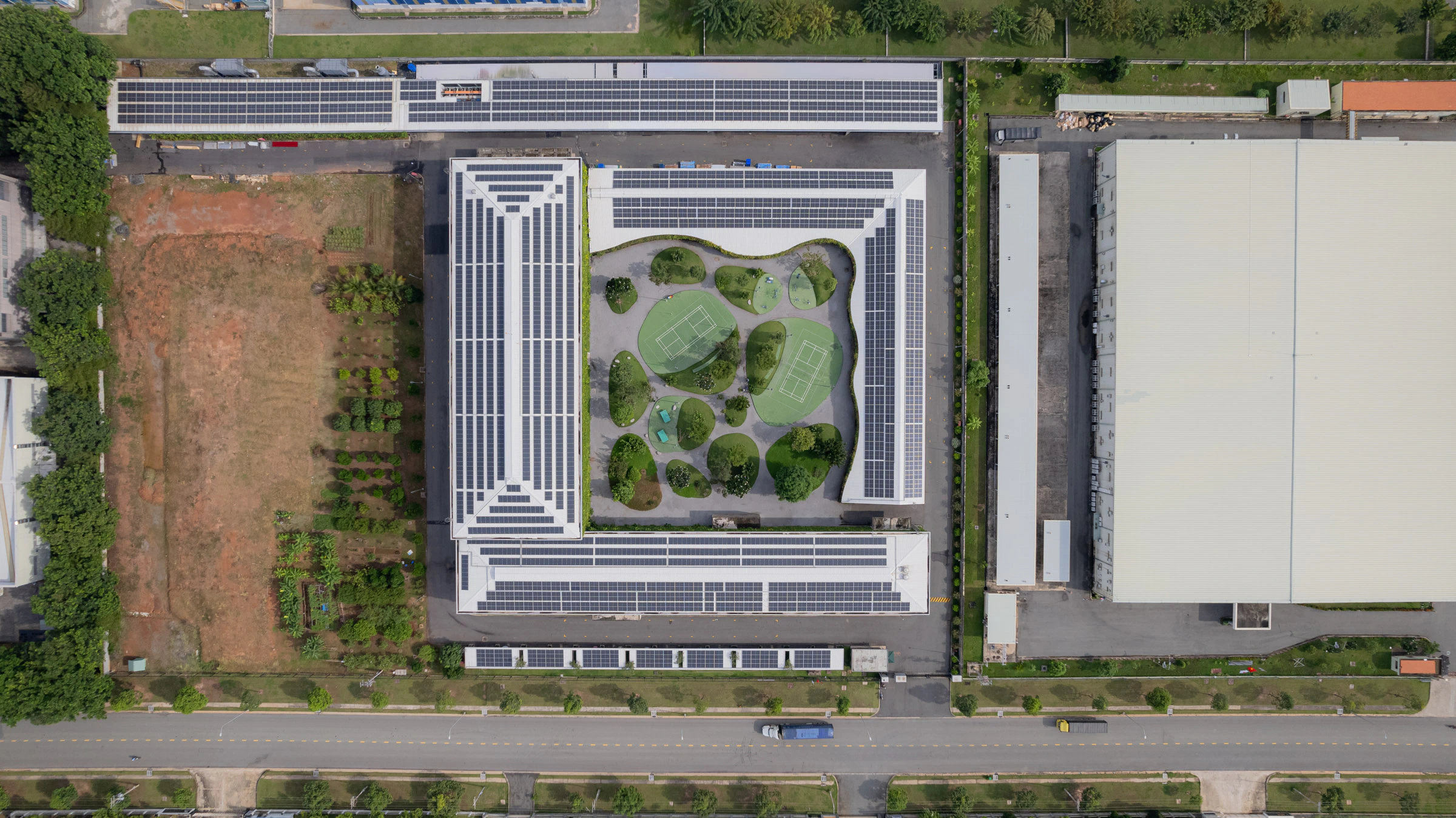 Solar panel factory roof and landscaped courtyard in Vietnam