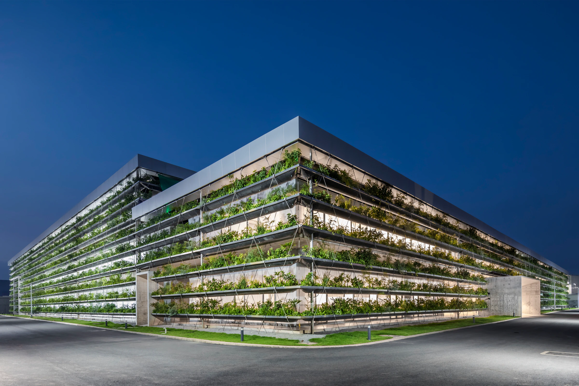 Jakob Factory planted façade and stainless-steel cable lattice