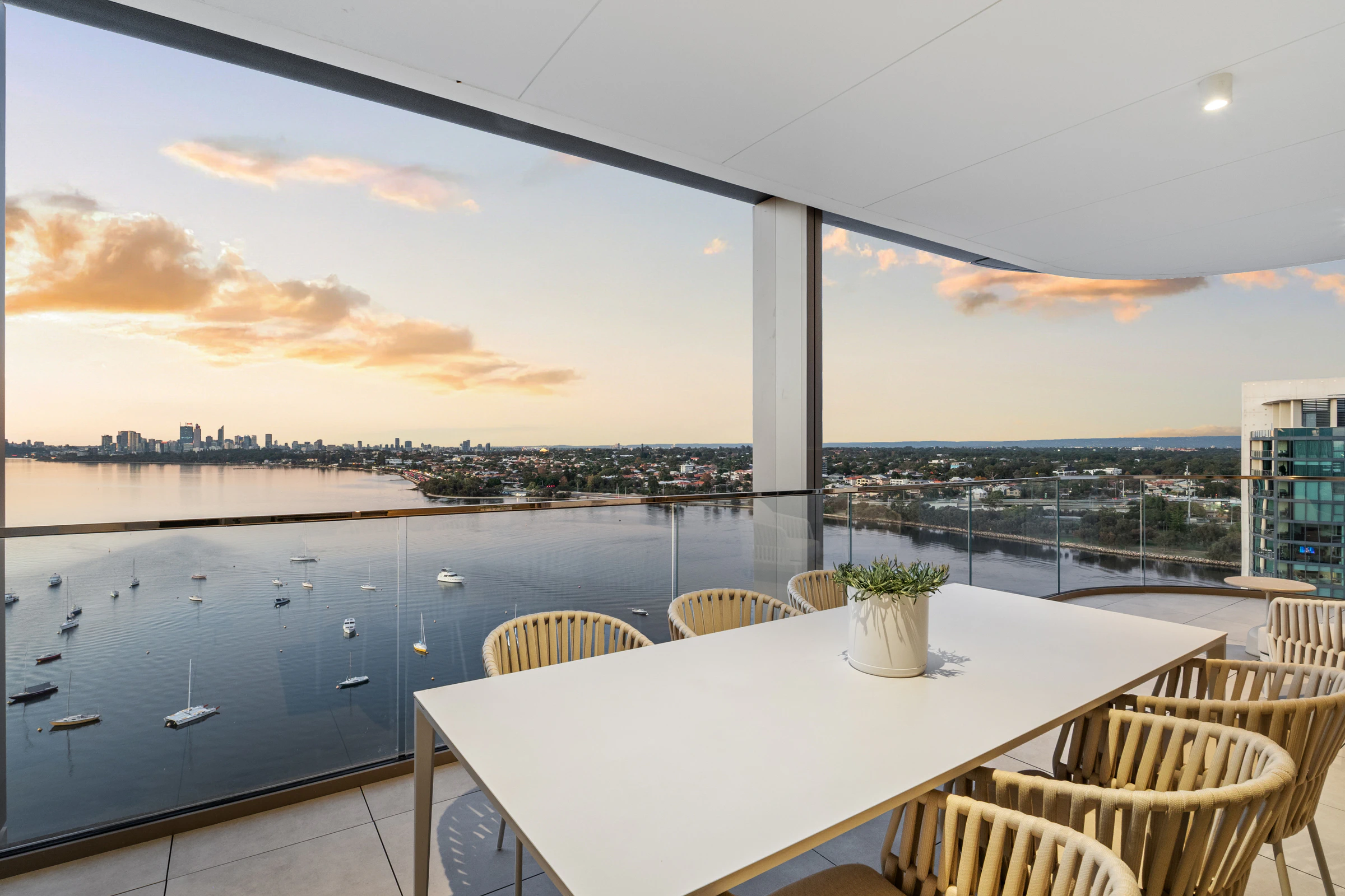 Expansive 25m² balcony offering panoramic views across the Swan River to the city skyline