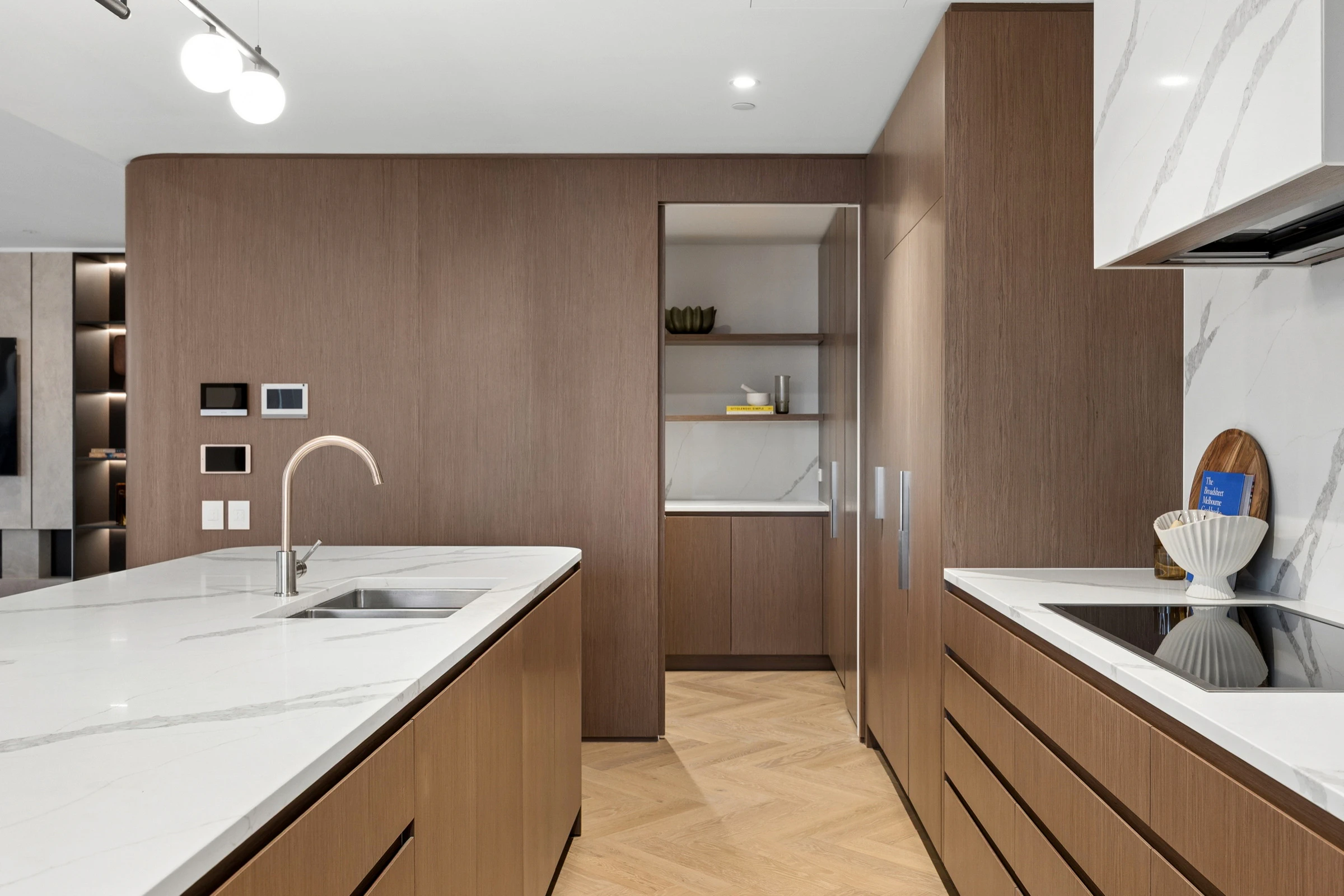 Generous kitchen extending to a caterer’s scullery with sink, bench space and additional storage