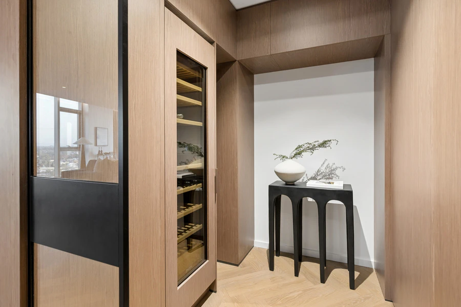 Dedicated walk-in wine storage with bespoke shelving and Liebherr wine fridge