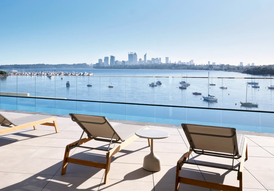 Furnished pool deck on the Level 3 podium offering panoramic views over the Swan River