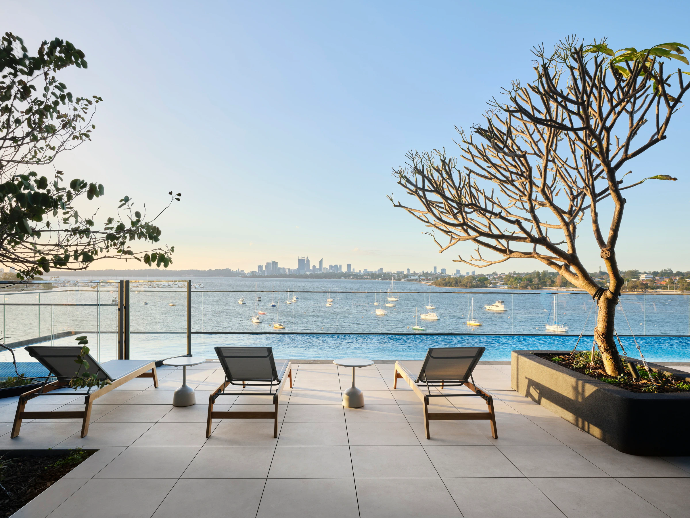 Furnished pool deck on the Level 3 podium offering panoramic views over the Swan River