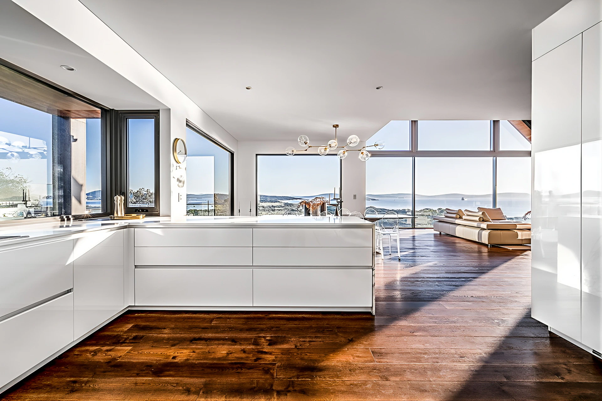 Open concept kitchen and living area overlooking sea view