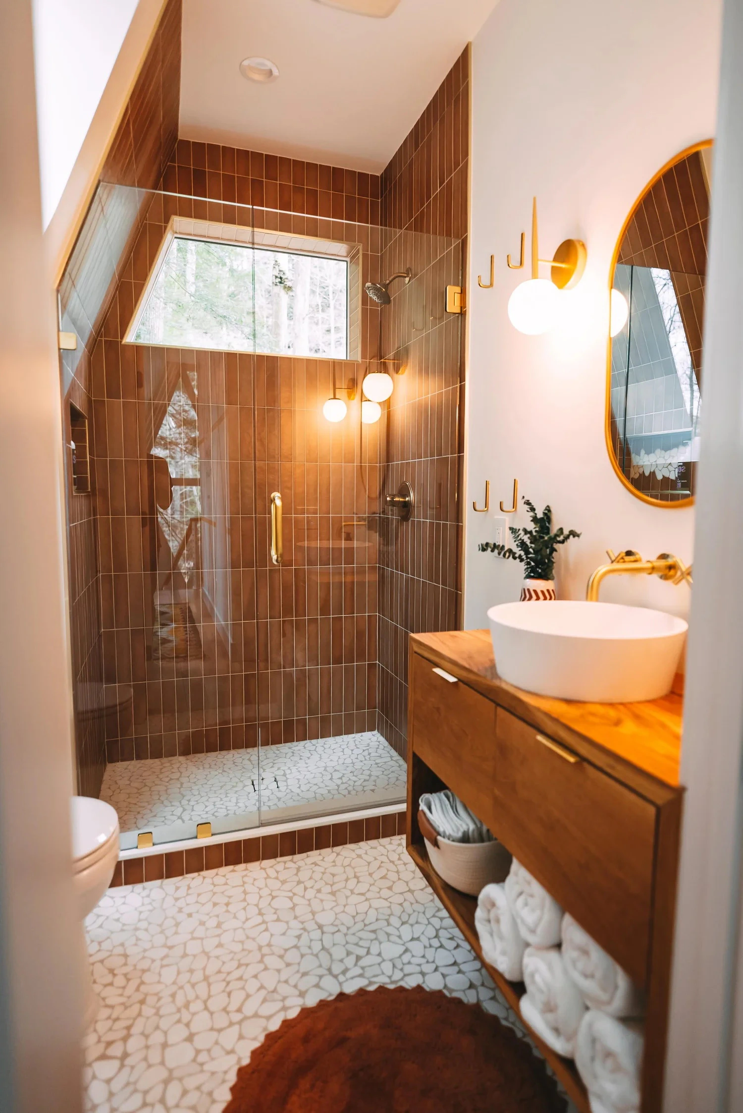 Bathroom with walk-in shower and wooden vanity
