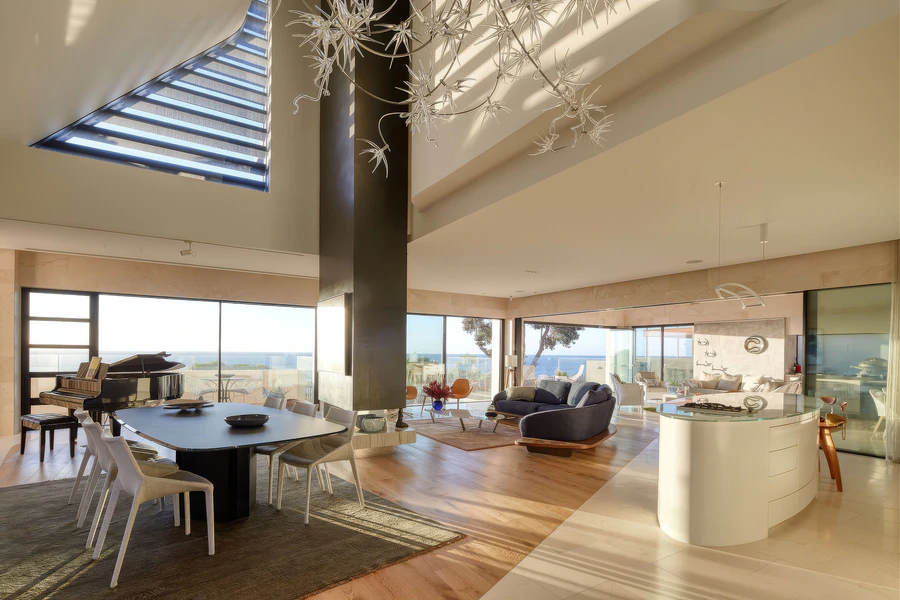 Open-plan living and dining area overlooking the ocean