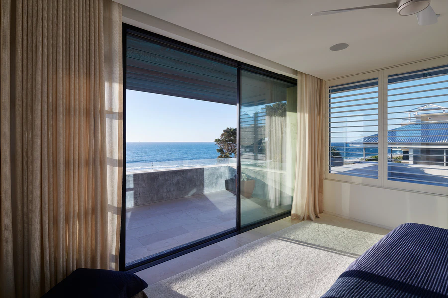 Bedroom overlooking balcony and ocean view