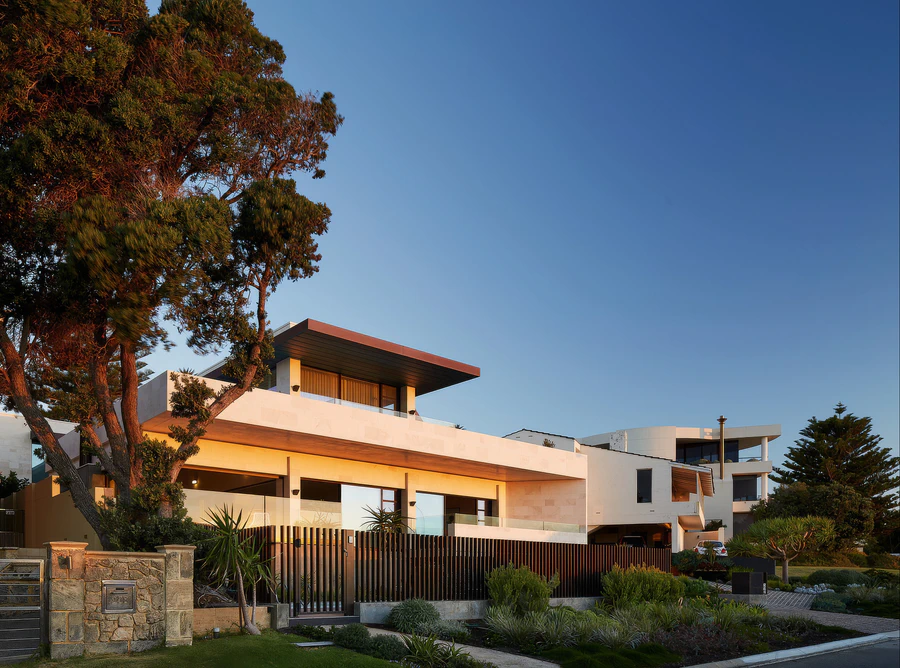 Contemporary coastal house exterior at dusk