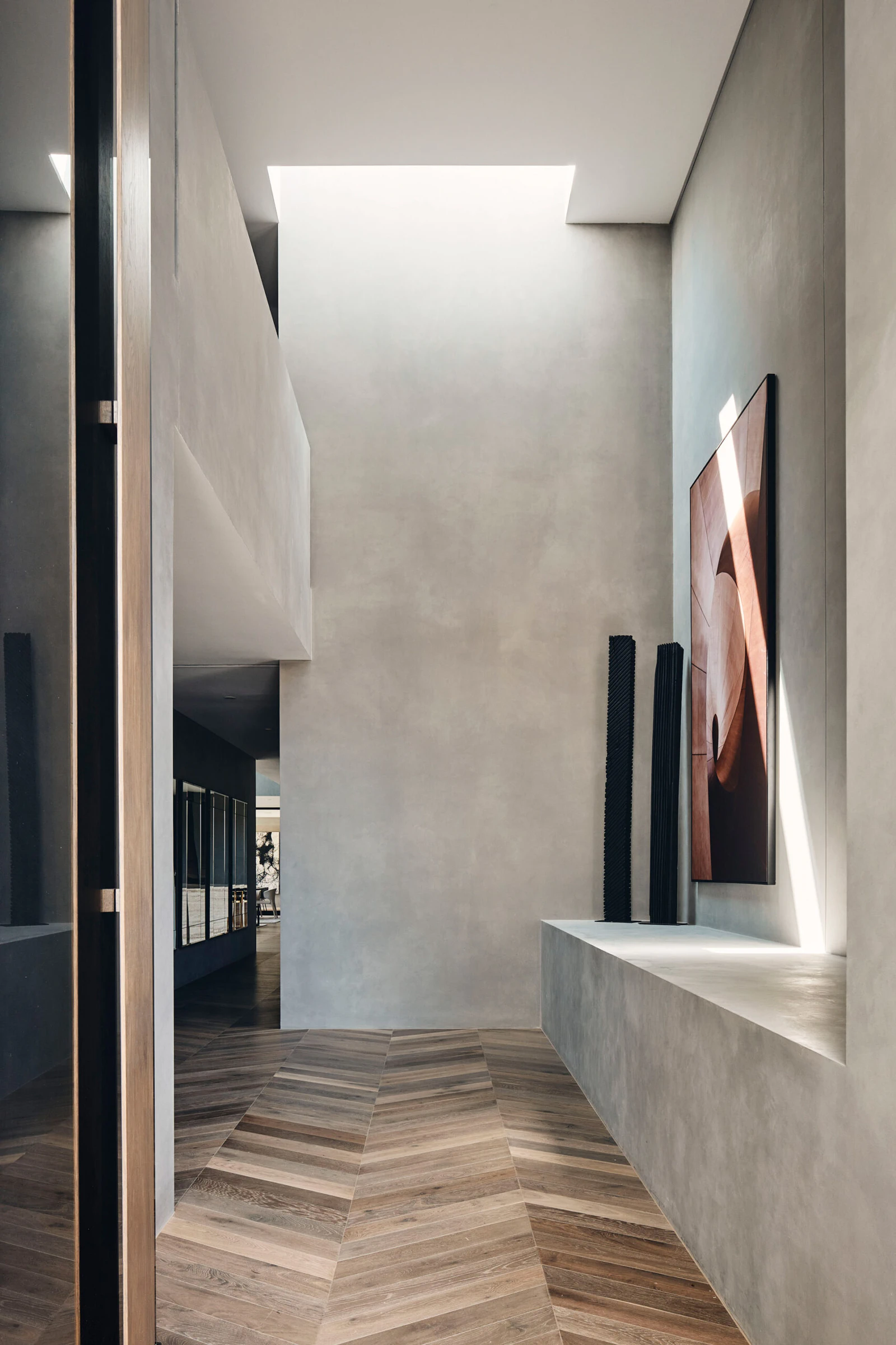 Hopetoun entry volume, concrete walls, skylight and chevron timber flooring