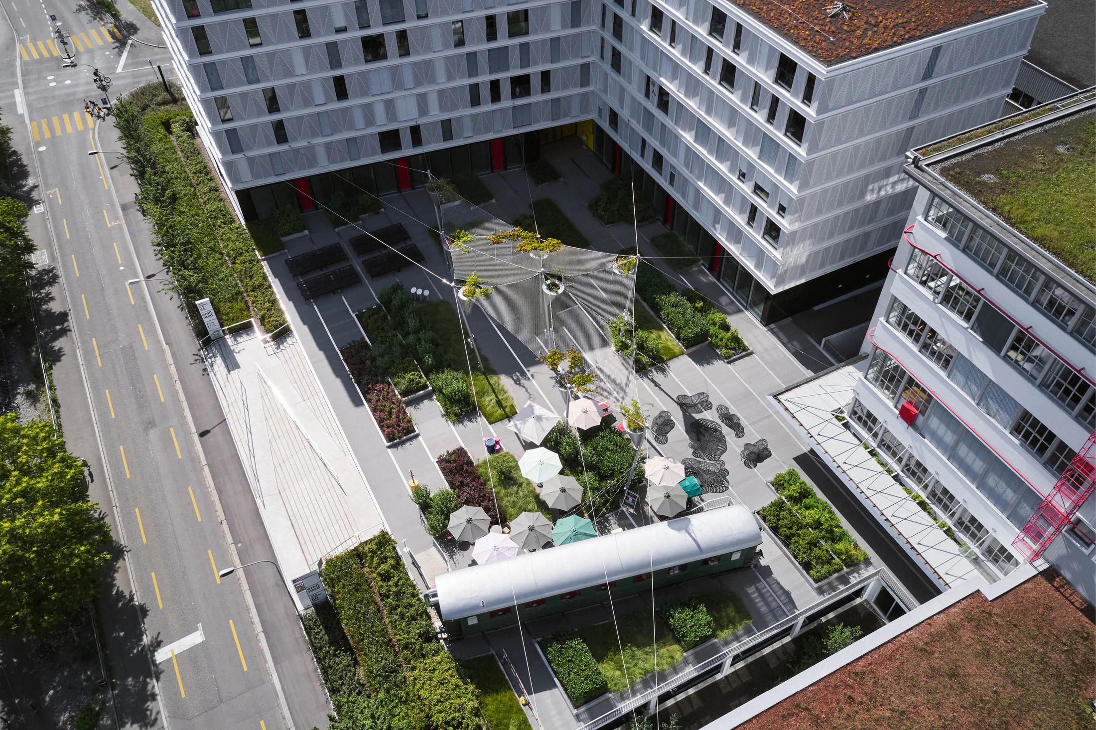 Emil North courtyard plaza and planted rooftops in Zurich-Oerlikon