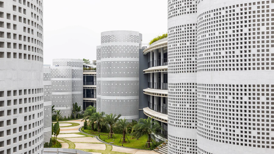 Infinity Village perforated cylindrical cores and landscaped courtyard