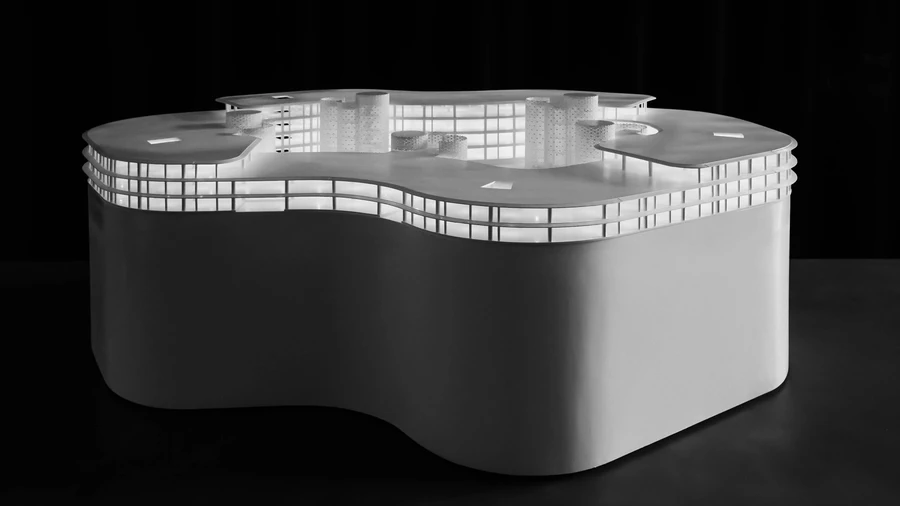 Infinity Village architectural model showing looped office campus design