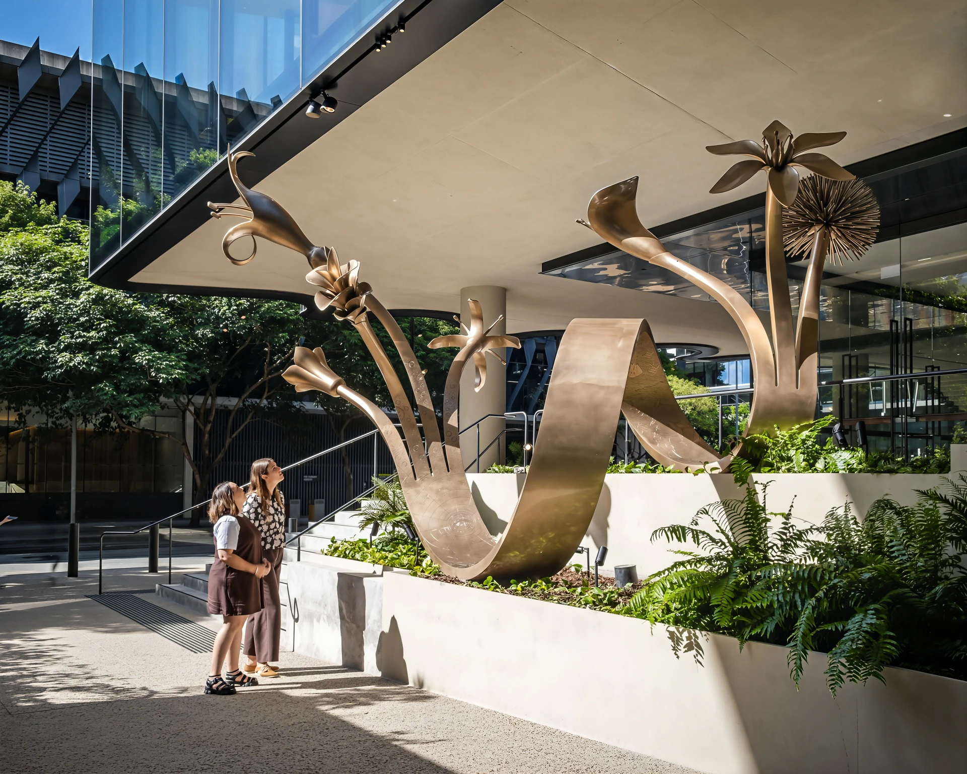 Brian Robinson’s bronze Floriate sculpture at building entrance courtyard