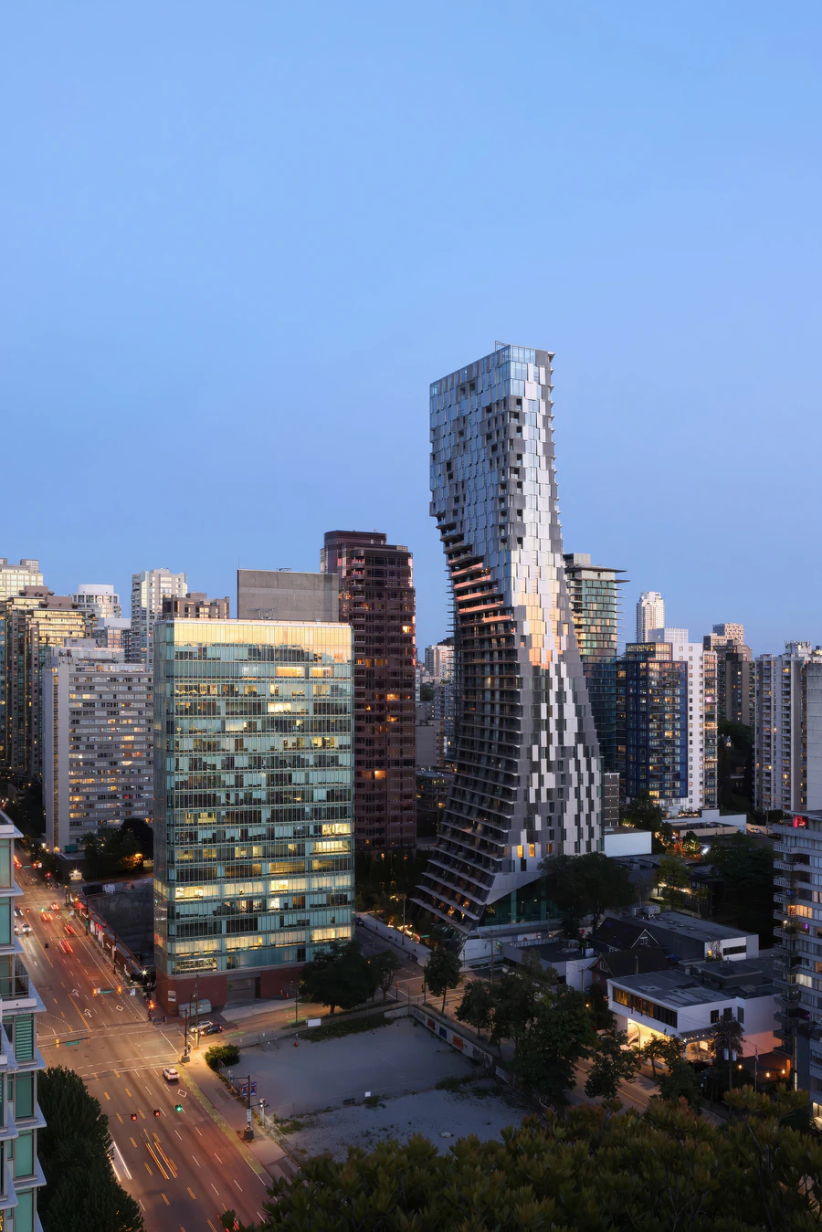 Alberni Tower in city skyline at dusk