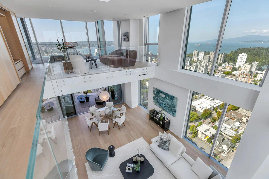 Penthouse apartment interior featuring floor-to-ceiling windows and city skyline views