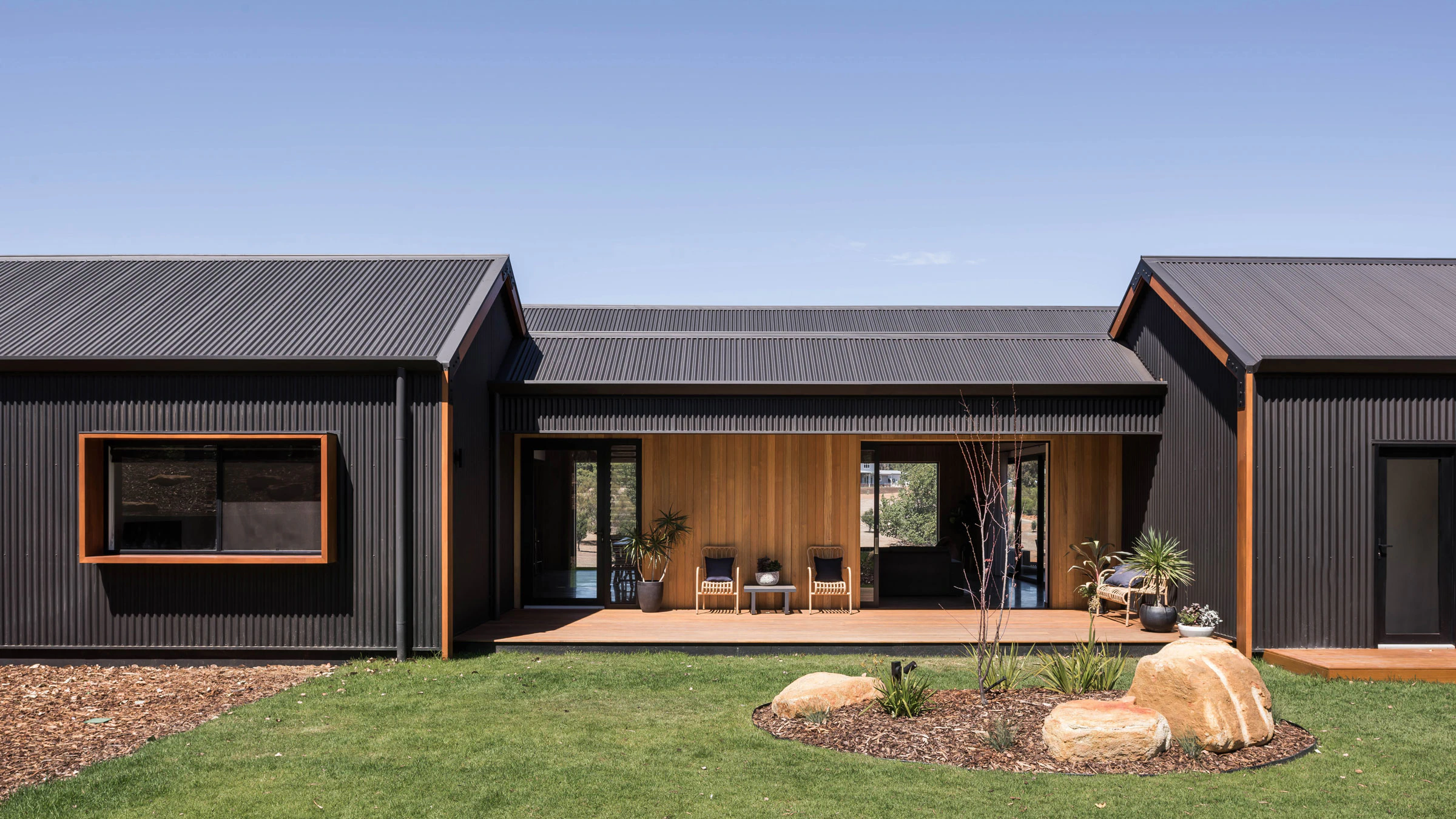 Stealth Farmhouse and itscentral wooden porch area