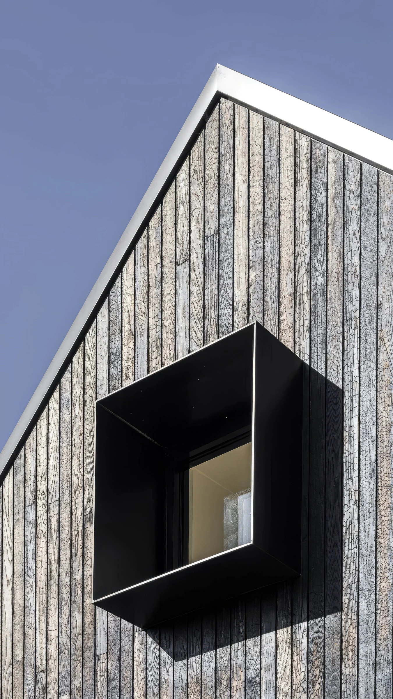Shou Sugi Ban gable façade and black window box