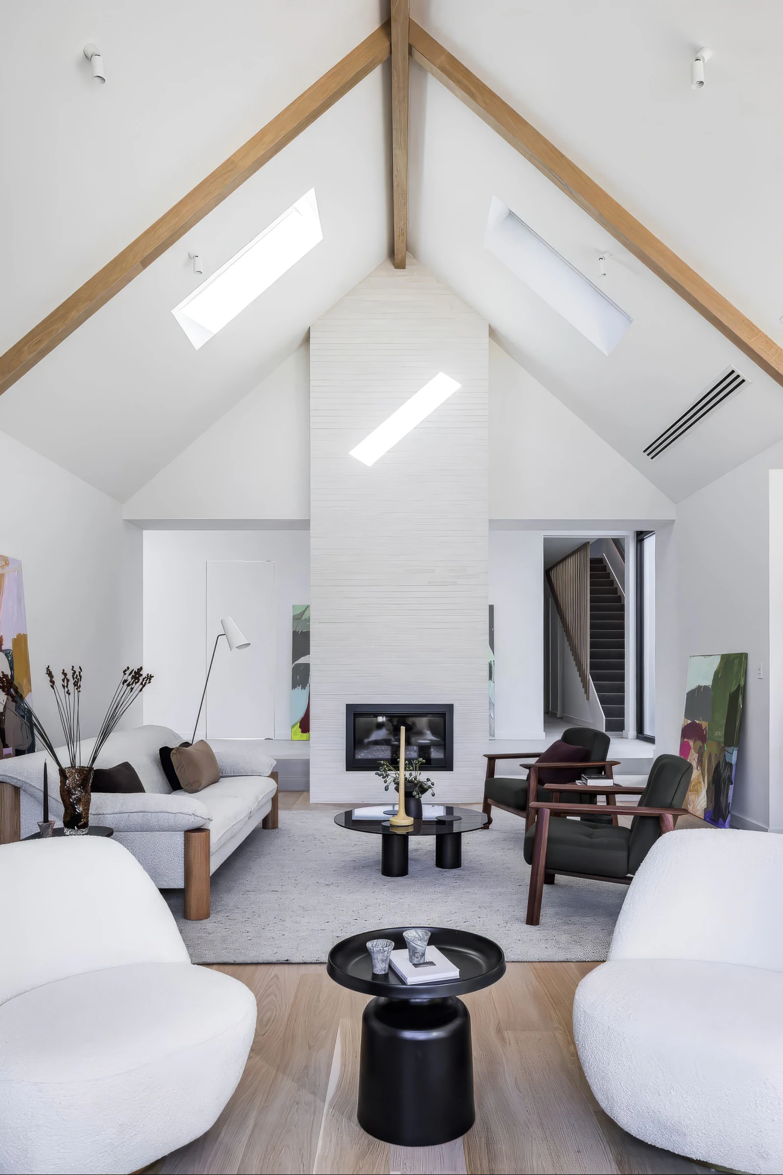 Peppermint Grove living room, raked ceiling, timber rafters and fireplace