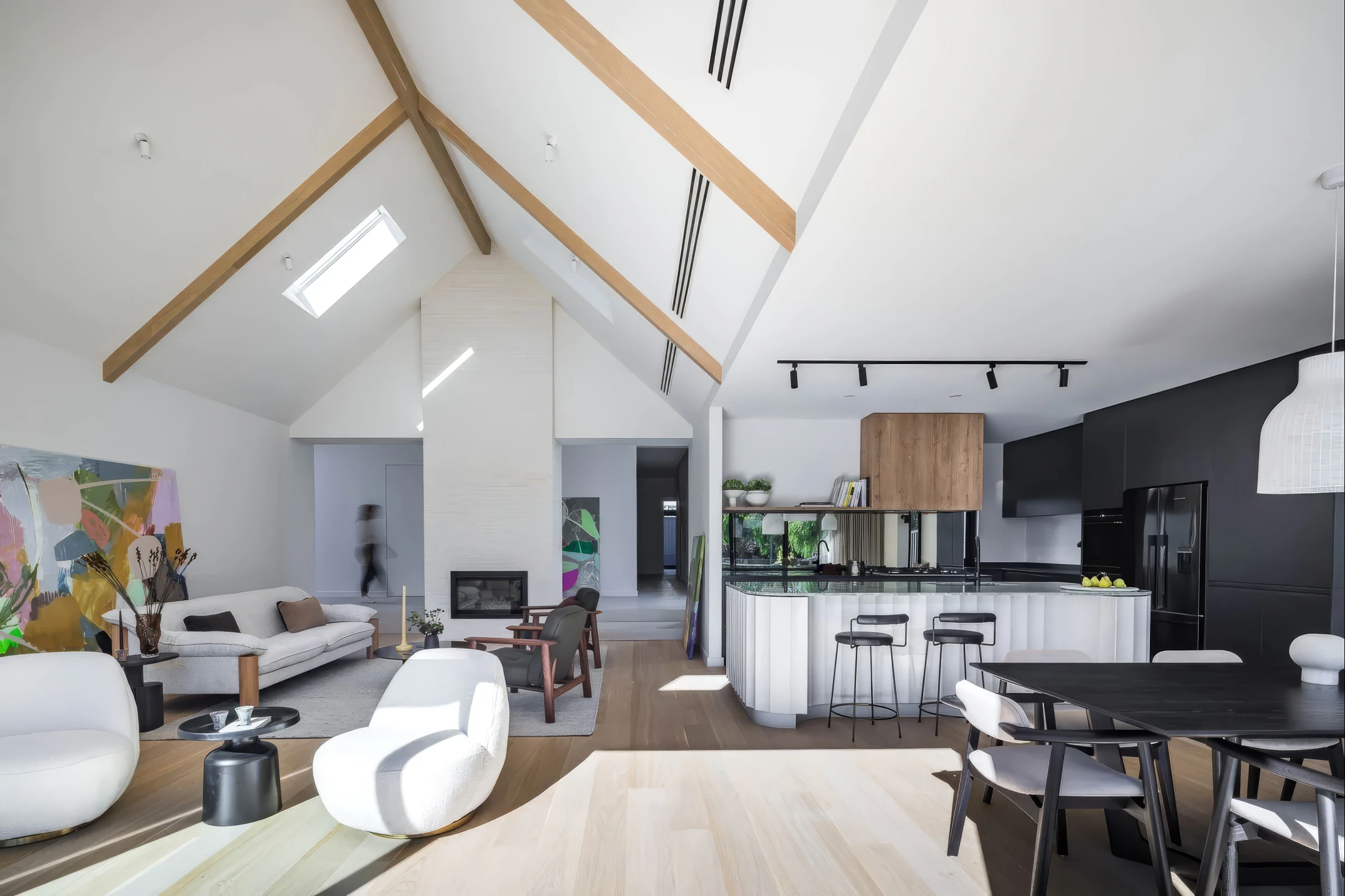 Open-plan living room and kitchen beneath raked timber rafters