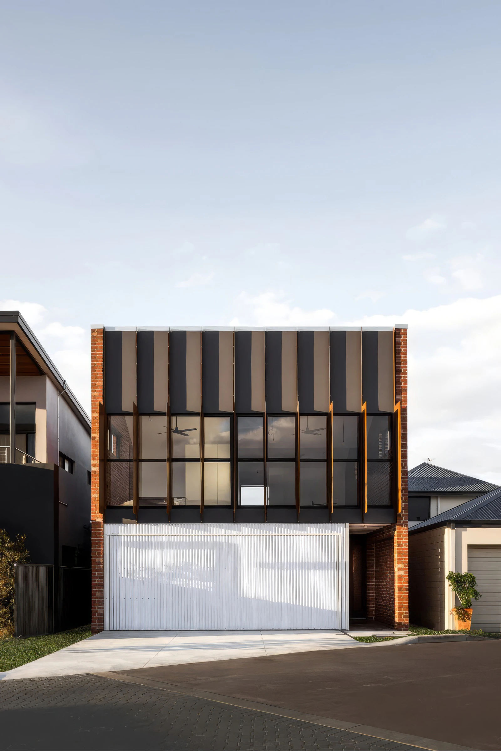 Picard Lane Home brick facade and black metal cladding