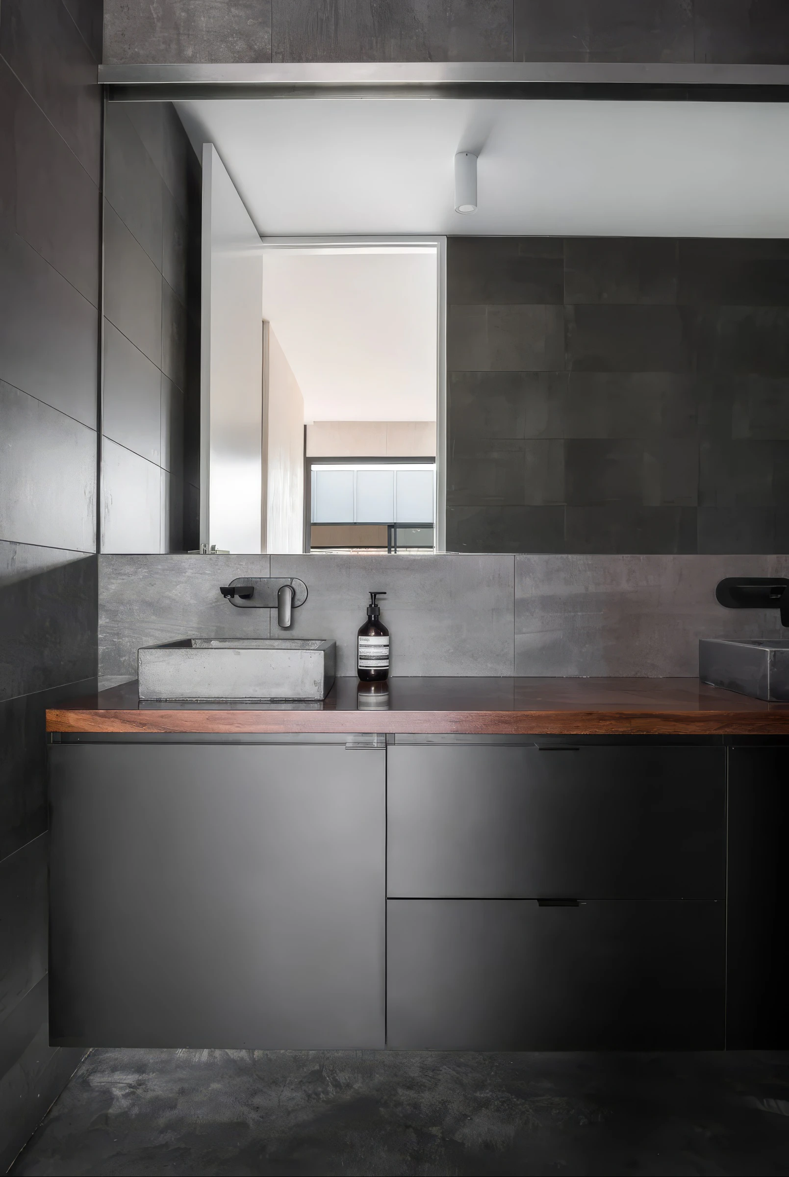Industrial bathroom vanity, dark tiles and timber counter